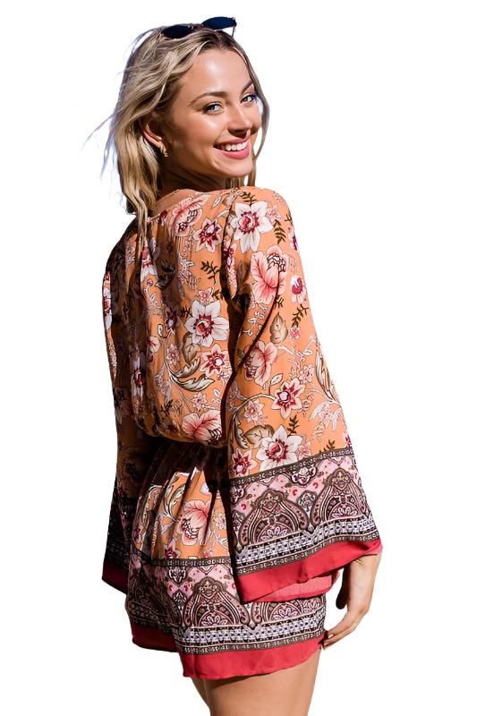 Create a look that stands out with this BOHO Bunch floral Print romper. This imported item offers a Long Sleeve Surplice Print with an elastic waistband for an adjustable fit. Available in sizes S, M, and L.