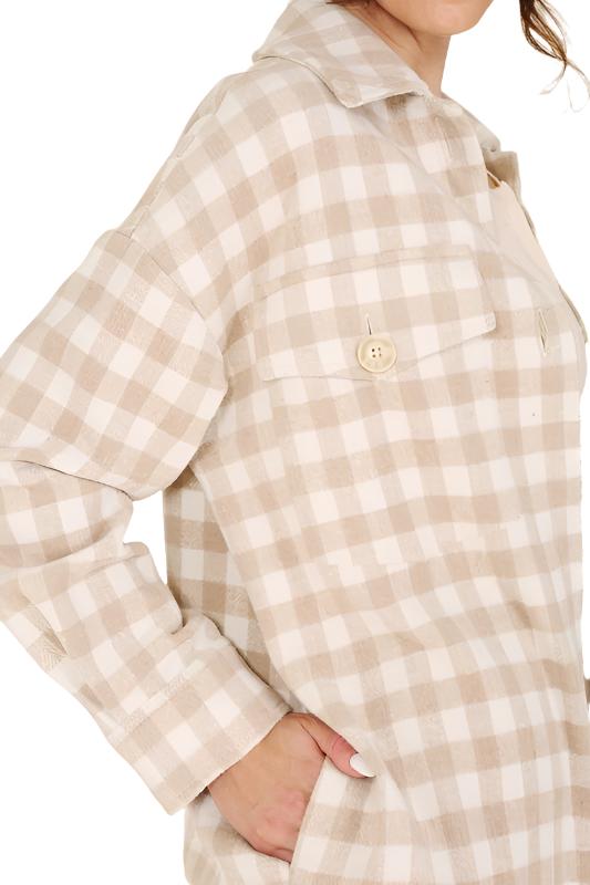 Introducing the Chia Checkered Jacket, a stylish and convenient layering piece for any outfit. Crafted from 100% polyester, this shacket features a shirt collar, regular sleeves, and long sleeves with functional buttons for opening. The check pattern adds a touch of sophistication, making it perfect for young, fashion-conscious consumers. This unisex item is available in sizes S to XL and is machine washable for easy care. The Chia Checkered Jacket is a versatile addition to any wardrobe...