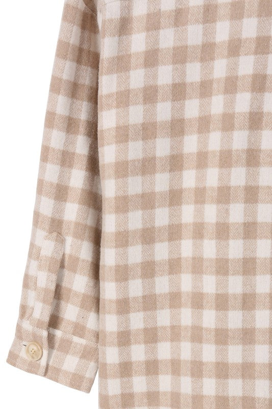 Introducing the Chia Checkered Jacket, a stylish and convenient layering piece for any outfit. Crafted from 100% polyester, this shacket features a shirt collar, regular sleeves, and long sleeves with functional buttons for opening. The check pattern adds a touch of sophistication, making it perfect for young, fashion-conscious consumers. This unisex item is available in sizes S to XL and is machine washable for easy care. The Chia Checkered Jacket is a versatile addition to any wardrobe...