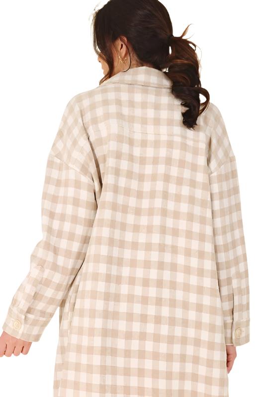 Introducing the Chia Checkered Jacket, a stylish and convenient layering piece for any outfit. Crafted from 100% polyester, this shacket features a shirt collar, regular sleeves, and long sleeves with functional buttons for opening. The check pattern adds a touch of sophistication, making it perfect for young, fashion-conscious consumers. This unisex item is available in sizes S to XL and is machine washable for easy care. The Chia Checkered Jacket is a versatile addition to any wardrobe...