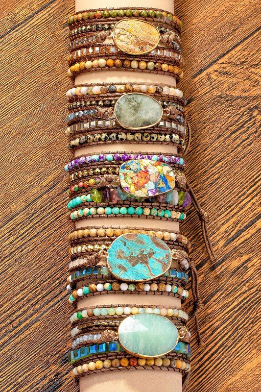 This one-of-a-kind natural stone ladies nomination bracelet is a stunning bracelet offers 5 options that features a delicate blend of golden encased stone and colorful matching stones that adds boho beauty to any outfit. 