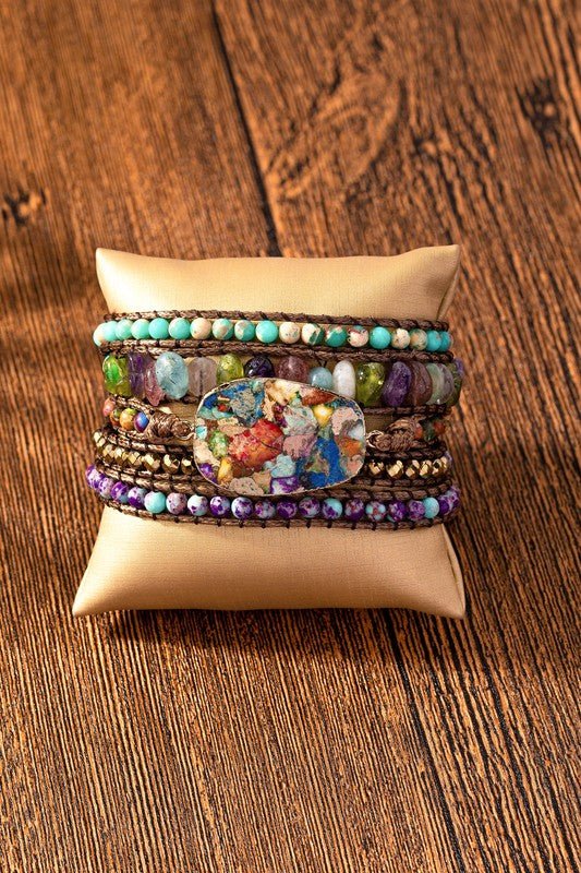  Featuringnatural stone ladies nomination bracelet a striking multi stone centerpiece, this versatile piece can be worn solo or wrapped five times around your wrist for a layered look