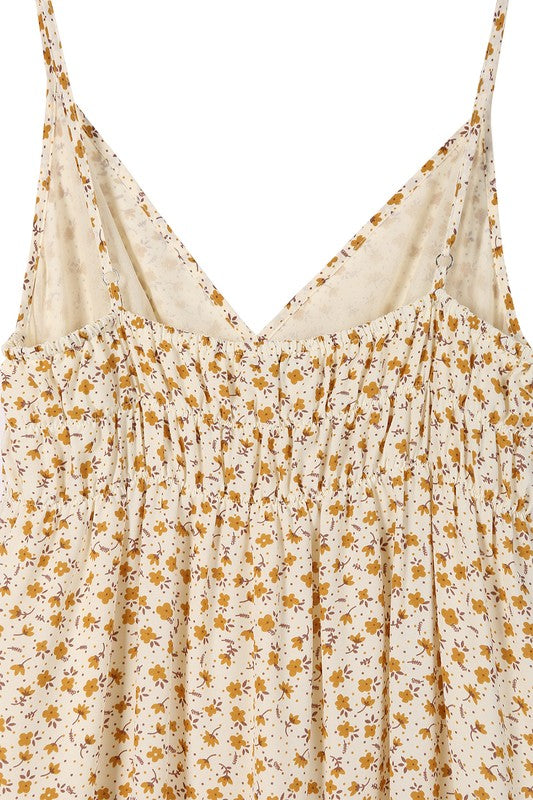 Create an enduring summer outfit with this SaliLue tank dress. It features a low cut V-neck and sleeveless construction, and comes in a bright yellow floral print. The dress is lined for opacity and should be machine washed cold for easy care. The length for a size Small is approximately 48".