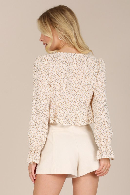 This Flora Floral Frill Blouse is the perfect addition to your wardrobe. Featuring a stylish floral pattern, a flattering V neck and puff sleeves. Crafted from a non-stretch material, it is not lined but not very sheer. To ensure its quality and longevity, machine wash cold and tumble dry low. Model is 5' 6" and wearing size Small; length is approx 17" in size Small.